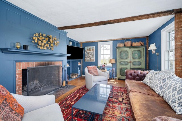 149 Limekiln Rd, Redding, CT 06896 - living area with beamed ceiling, a fireplace, and wood finished floors