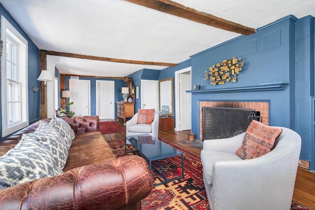 149 Limekiln Rd, Redding, CT 06896 - living area with beam ceiling, a fireplace, and wood finished floors