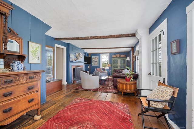 149 Limekiln Rd, Redding, CT 06896 - living room with hardwood / wood-style floors, a fireplace, and beamed ceiling