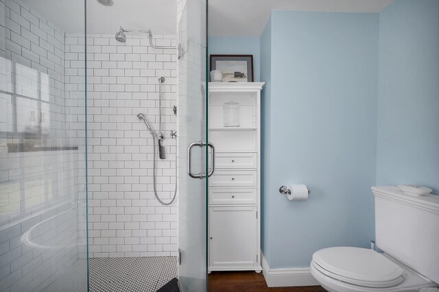 149 Limekiln Rd, Redding, CT 06896 - bathroom with a stall shower, toilet, and baseboards