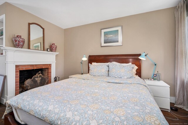 149 Limekiln Rd, Redding, CT 06896 - bedroom with a brick fireplace and wood finished floors