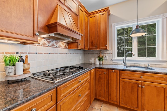 41 Madison Way S, Windsor, CT 06074 - kitchen featuring stainless steel gas cooktop, a sink, custom exhaust hood, brown cabinetry, and dark stone counters