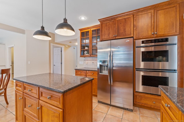 41 Madison Way S, Windsor, CT 06074 - kitchen featuring appliances with stainless steel finishes, light tile patterned floors, brown cabinets, glass insert cabinets, and recessed lighting
