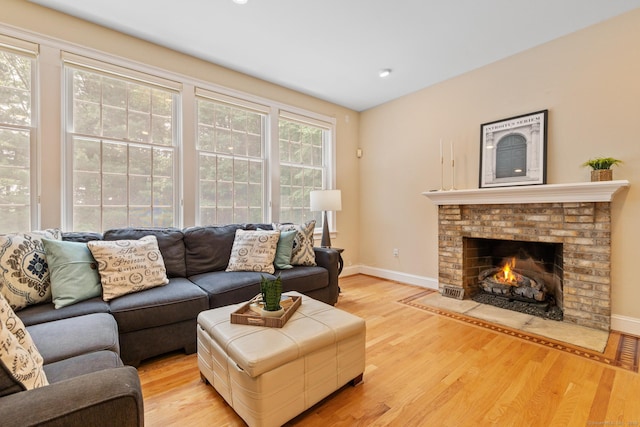 41 Madison Way S, Windsor, CT 06074 - living room featuring light wood-type flooring, baseboards, and a brick fireplace