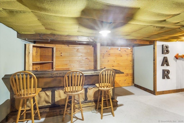 bar with wooden walls and a dry bar