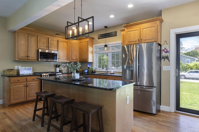 14 Cutter Dr, Stonington, CT 06355 - kitchen featuring appliances with stainless steel finishes, wood finished floors, a center island, baseboards, and recessed lighting