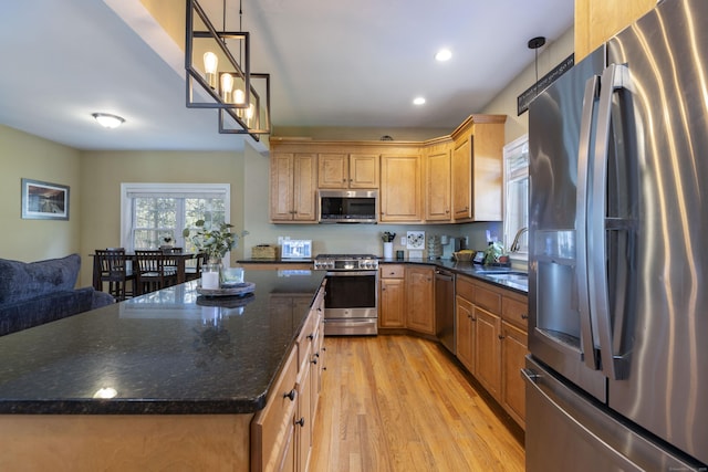14 Cutter Dr, Stonington, CT 06355 - kitchen with stainless steel appliances, a sink, light wood finished floors, a kitchen island, and recessed lighting