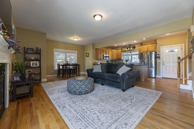14 Cutter Dr, Stonington, CT 06355 - living area featuring light wood-style flooring, baseboards, a chandelier, stairs, and recessed lighting