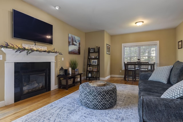 14 Cutter Dr, Stonington, CT 06355 - living room featuring wood finished floors, a fireplace, and baseboards