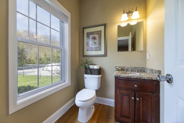 14 Cutter Dr, Stonington, CT 06355 - bathroom featuring baseboards, wood finished floors, toilet, and vanity
