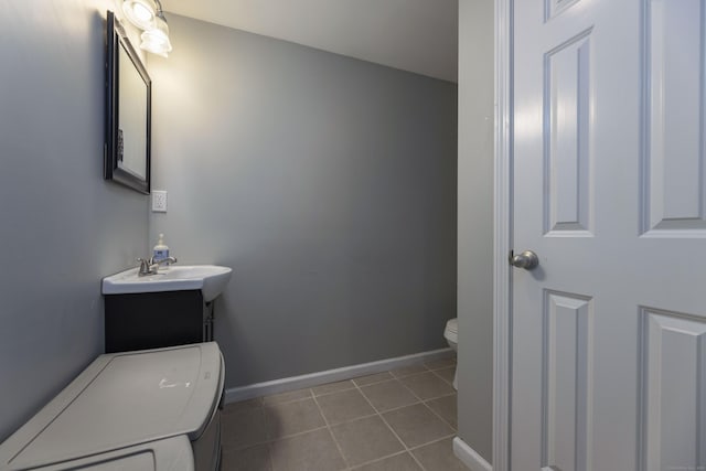 14 Cutter Dr, Stonington, CT 06355 - half bathroom featuring toilet, tile patterned floors, baseboards, and a sink