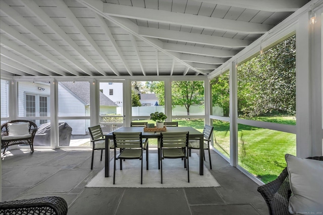 sunroom with outdoor dining space