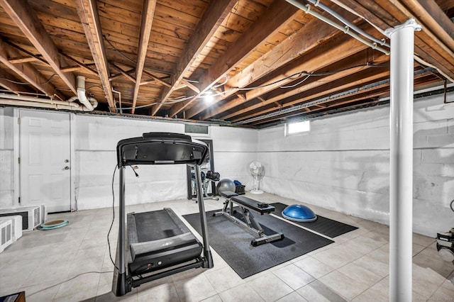 workout room with tile patterned floors