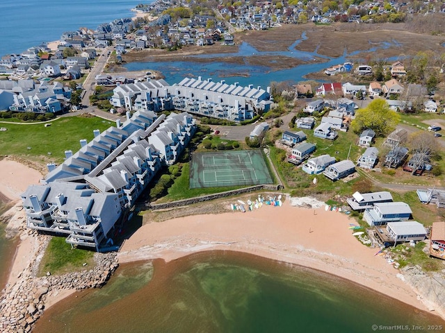drone / aerial view with a water view and a residential view