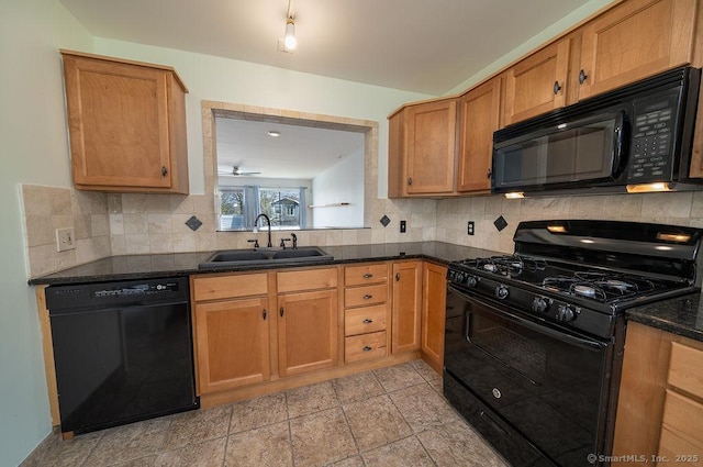 kitchen featuring dark countertops, tasteful backsplash, brown cabinets, a sink, and black appliances