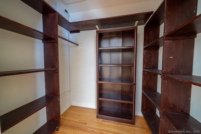spacious closet with wood finished floors