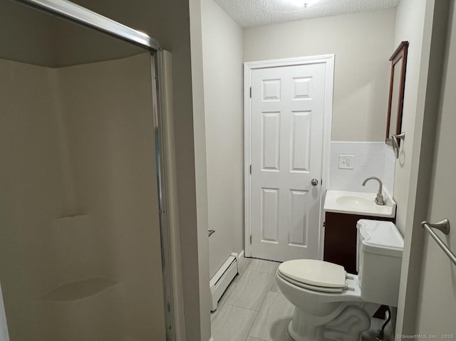 full bathroom with vanity, toilet, a textured ceiling, a baseboard heating unit, and a stall shower