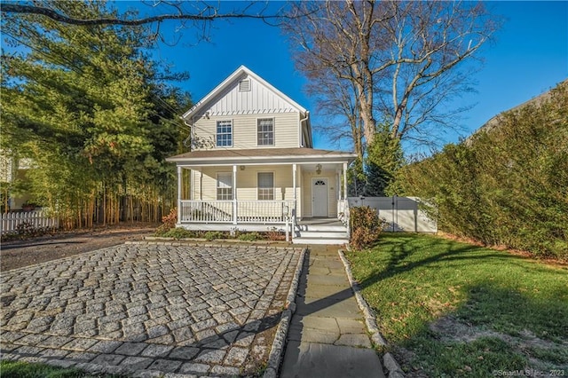 view of front facade featuring board and batten siding and covered porch