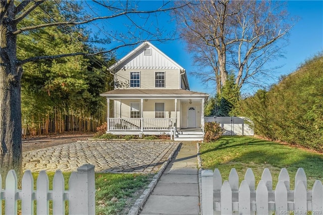 farmhouse inspired home with board and batten siding and a porch