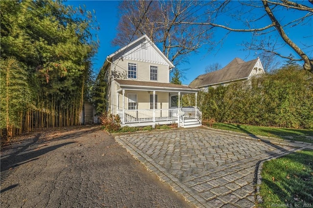 view of front of house with covered porch and board and batten siding