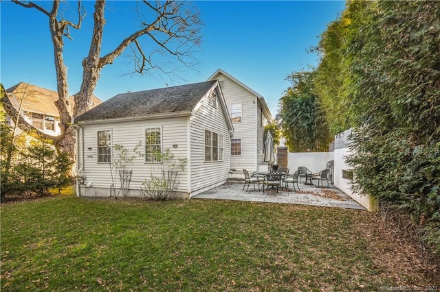 back of property with a patio area