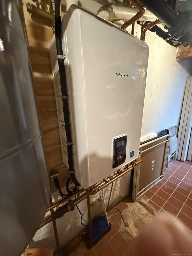 utility room with water heater