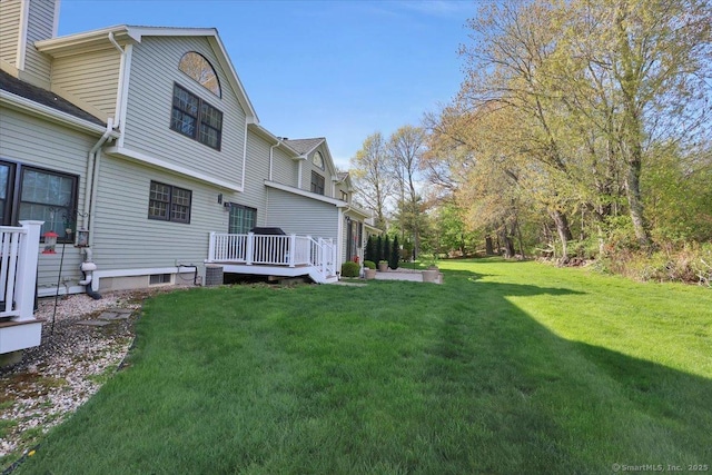 view of yard with a wooden deck