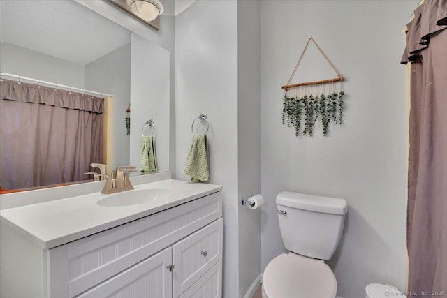 full bath with vanity and toilet