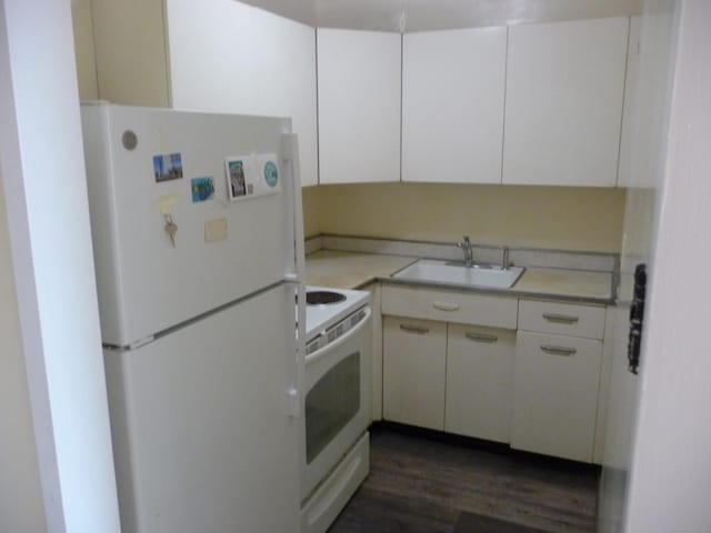 100 York St Unit 9H, New Haven, CT 06511 - kitchen with dark wood-style flooring, a sink, light countertops, white cabinets, and white appliances