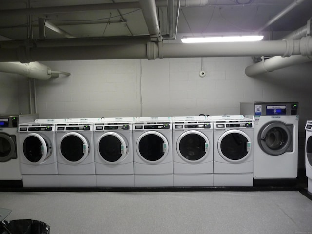 100 York St Unit 9H, New Haven, CT 06511 - common laundry area featuring washer and dryer and concrete block wall