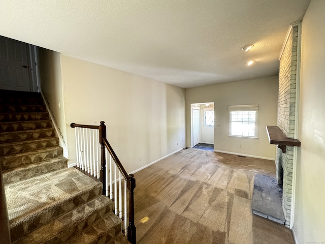 267 Strawberry Cir, Windsor, CT 06095 - stairs featuring carpet flooring, a textured ceiling, and baseboards