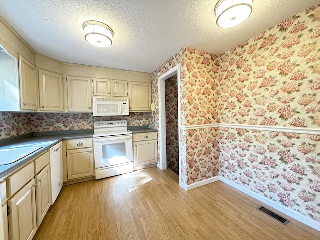 267 Strawberry Cir, Windsor, CT 06095 - kitchen featuring white appliances, wallpapered walls, light wood-style floors, baseboards, and a textured ceiling
