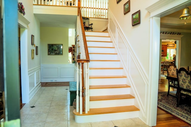 45 N Gate Rd, Woodbury, CT 06798 - stairs featuring a decorative wall, crown molding, a wainscoted wall, and tile patterned flooring