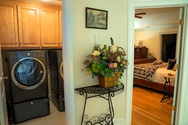45 N Gate Rd, Woodbury, CT 06798 - washroom with cabinet space, washing machine and clothes dryer, light wood-style flooring, and ceiling fan