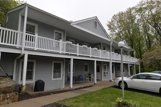 back of house featuring covered porch