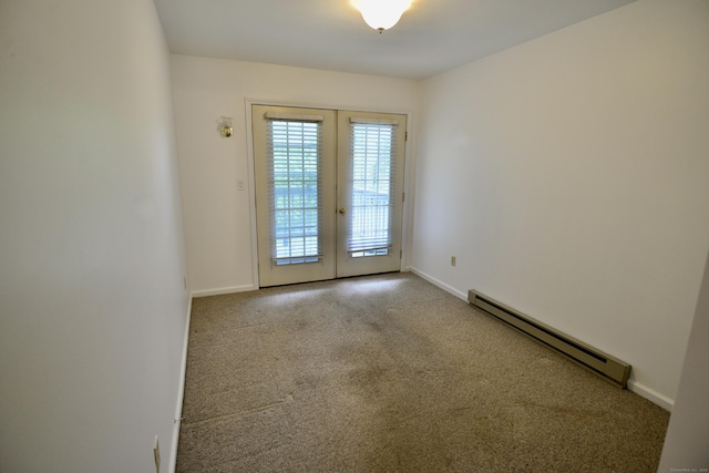 unfurnished room with a baseboard radiator, french doors, carpet flooring, and baseboards