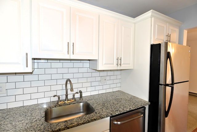 107 Hidden Knolls Cir Unit 107, Monroe, CT 06468 - kitchen featuring stainless steel appliances, a sink, white cabinetry, and backsplash
