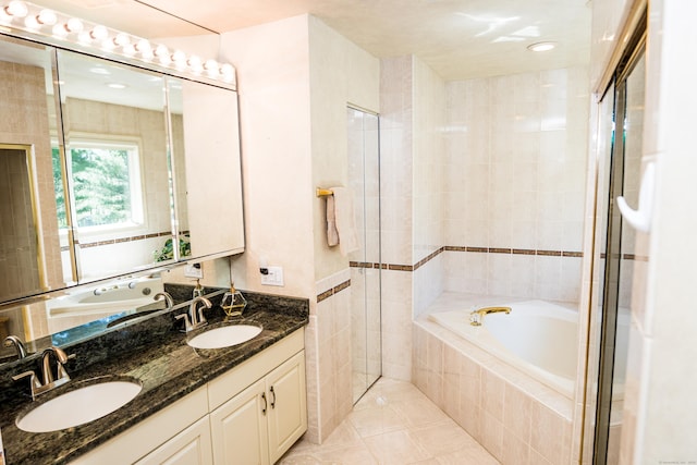 full bath with a garden tub, a sink, and double vanity