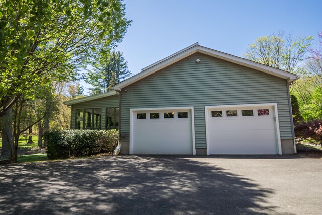 view of side of property with an attached garage