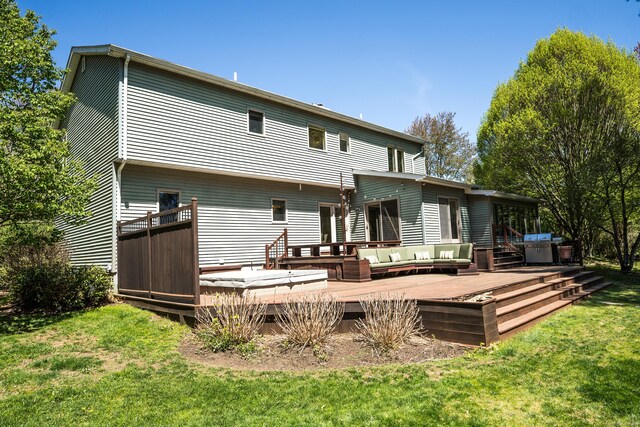 back of house featuring a wooden deck, a yard, and an outdoor hangout area