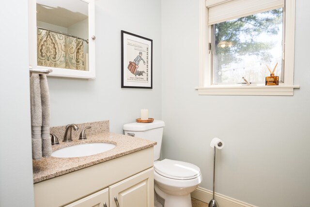 bathroom featuring vanity and toilet