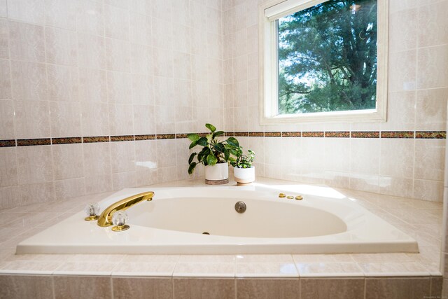 full bath with a garden tub