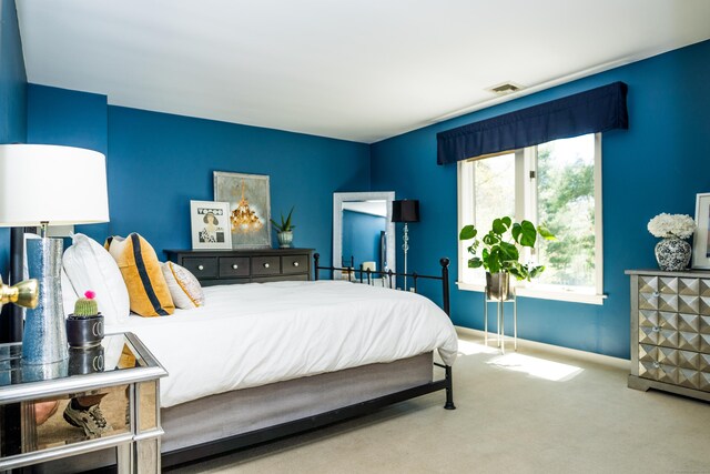carpeted bedroom featuring baseboards