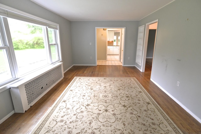 59 Old Ridgebury Rd, Danbury, CT 06810 - interior space with radiator, baseboards, and dark wood-type flooring