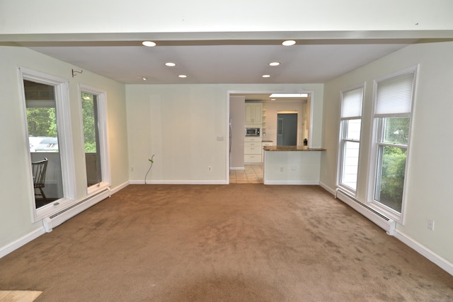 59 Old Ridgebury Rd, Danbury, CT 06810 - unfurnished living room featuring carpet floors, baseboards, and baseboard heating