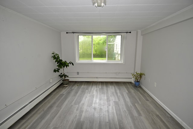 59 Old Ridgebury Rd, Danbury, CT 06810 - unfurnished room featuring ornamental molding, a baseboard radiator, and wood finished floors