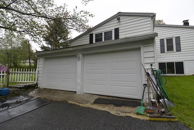 59 Old Ridgebury Rd, Danbury, CT 06810 - garage with aphalt driveway and fence