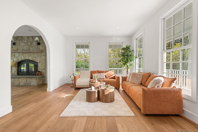 82 Indian Hill Rd, Wilton, CT 06897 - living room featuring wood finished floors, a stone fireplace, baseboards, and recessed lighting