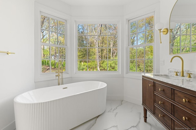 82 Indian Hill Rd, Wilton, CT 06897 - bathroom with vanity, baseboards, a soaking tub, and marble look tile flooring