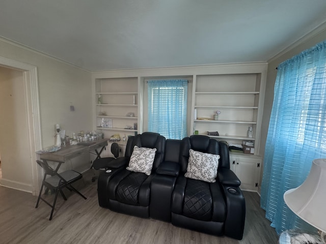 34 Knollwood Rd, East Hartford, CT 06118 - living area featuring built in features, wood finished floors, and ornamental molding